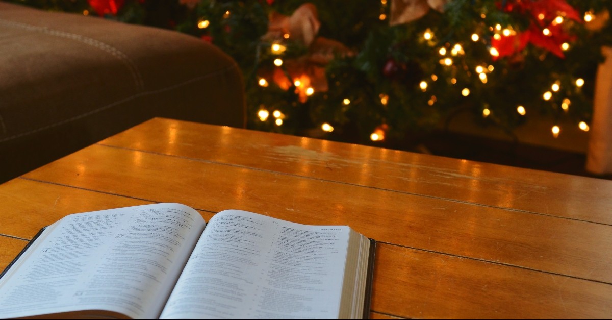 Bible in front of the Christmas Tree