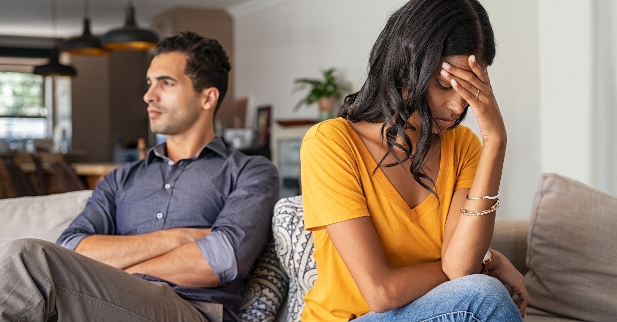 wife and husband upset with each other sitting on couch, when you fear you're not enough for spouse