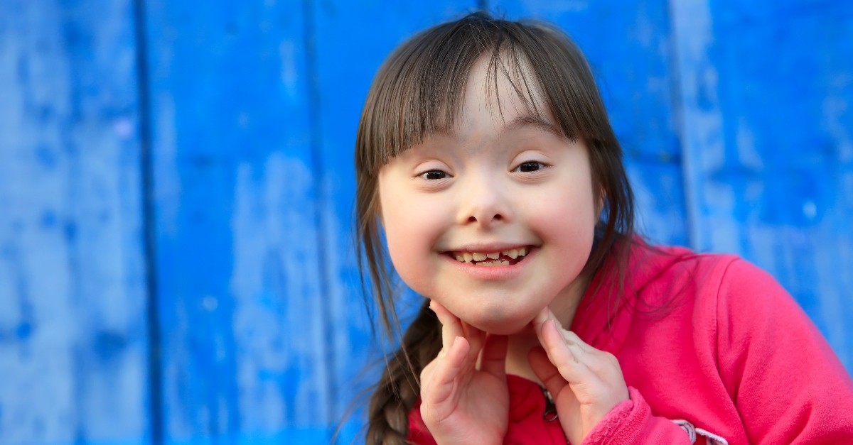 happy girl with down syndrome smiling