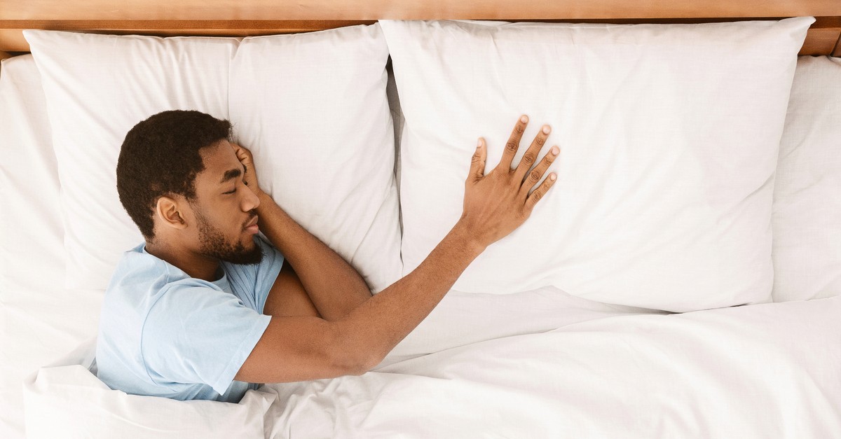 man sleeping without wife couple in bed