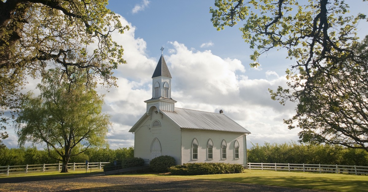 white church building in rural area,