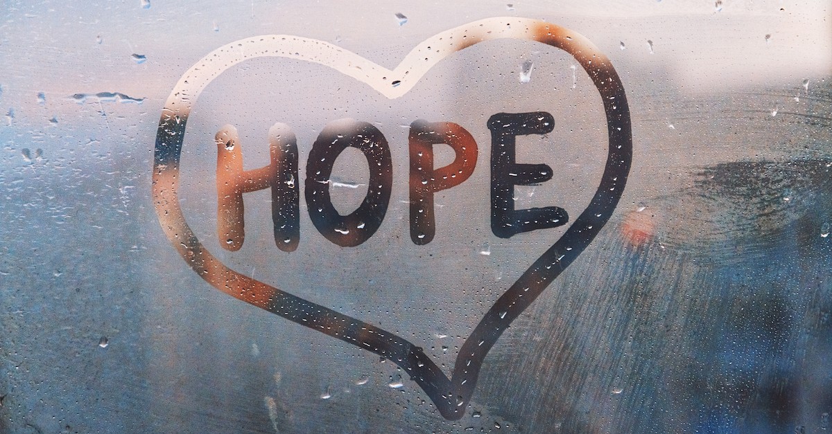 window with gloomy outside by Hope written in condensation