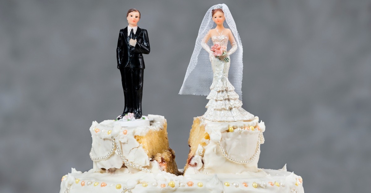 wedding cake with divide between groom and bride, most common roots of jealousy in marriage
