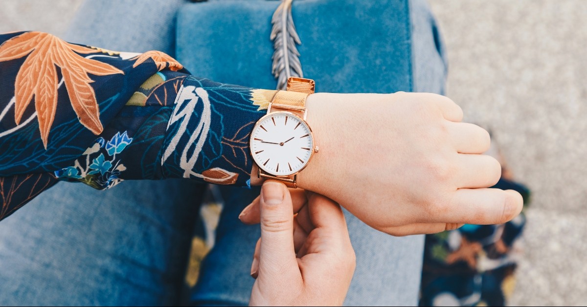 Woman looking at her watch