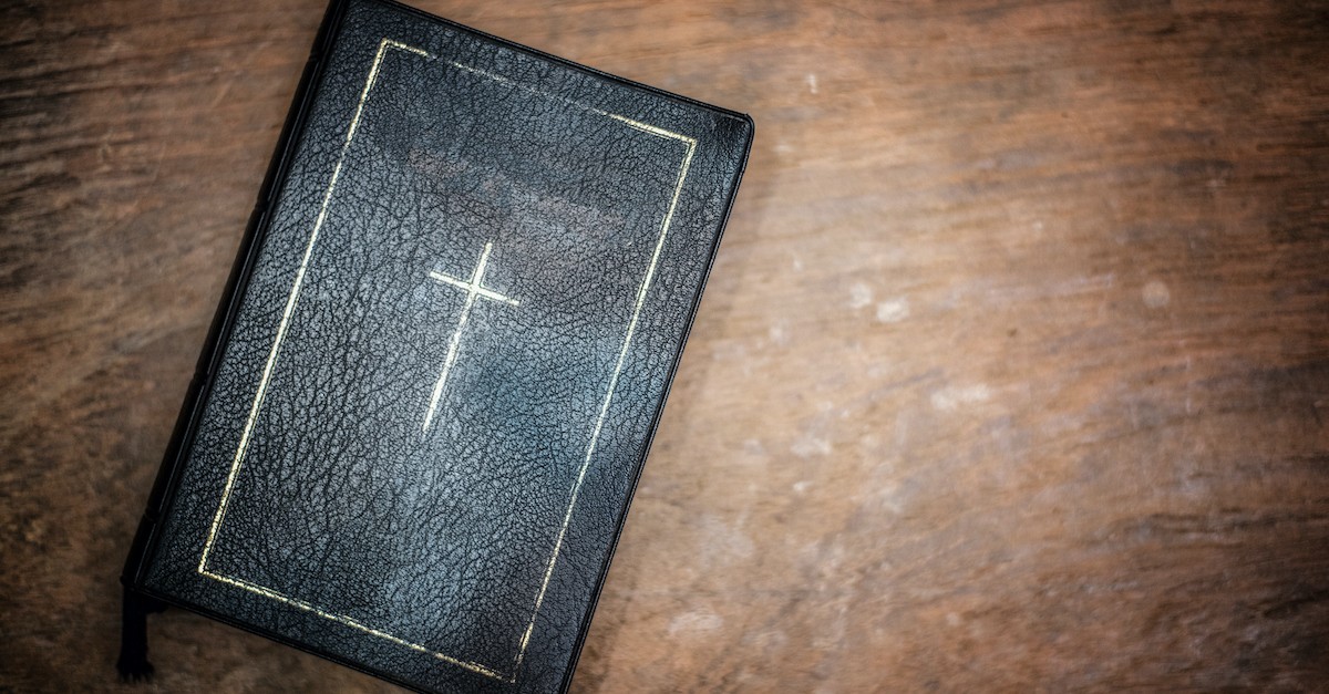Bible with cross design on top