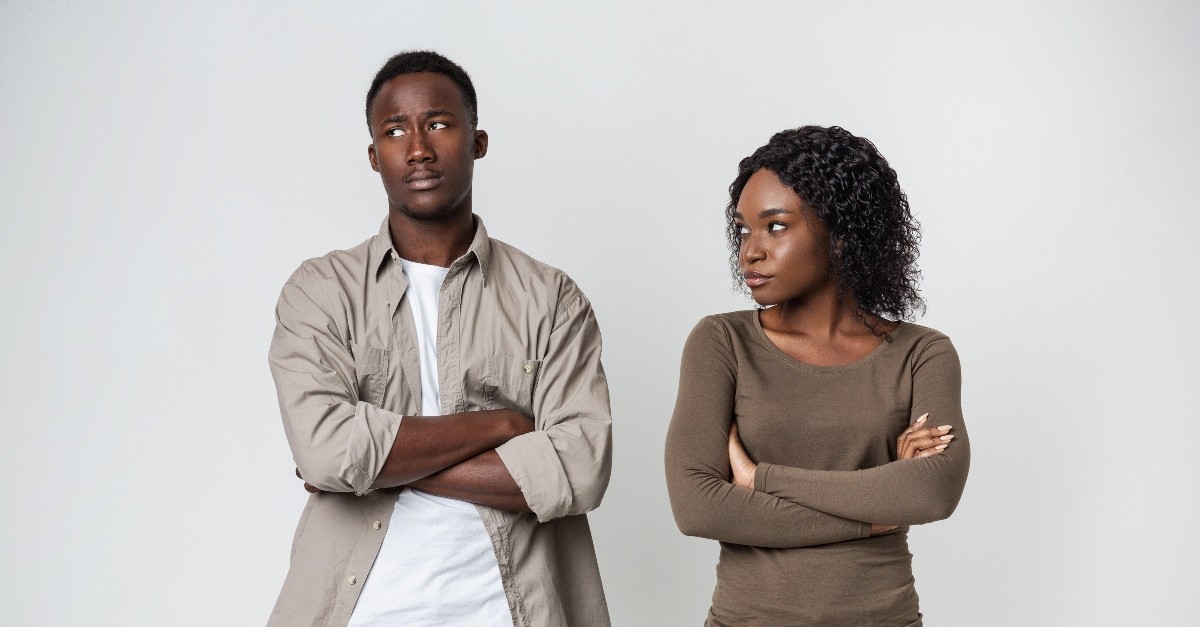 young couple looking upset with each other