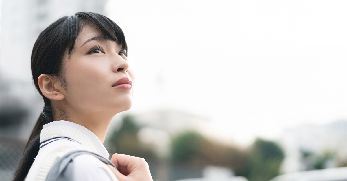 young woman looking up, there is always hope.