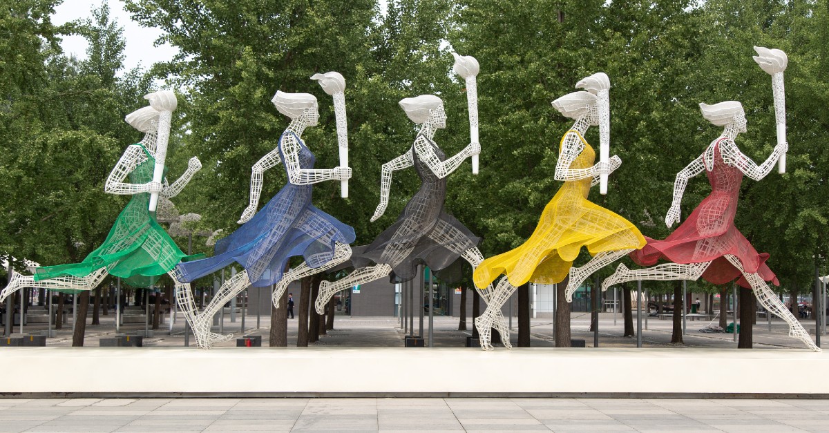 statue of runners in the olympics