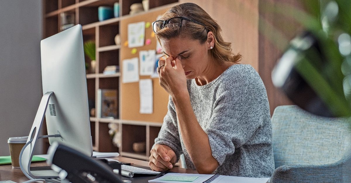 Woman at working looking stressed