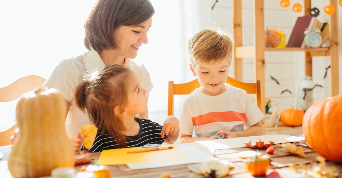 mom with kids making halloween crafts