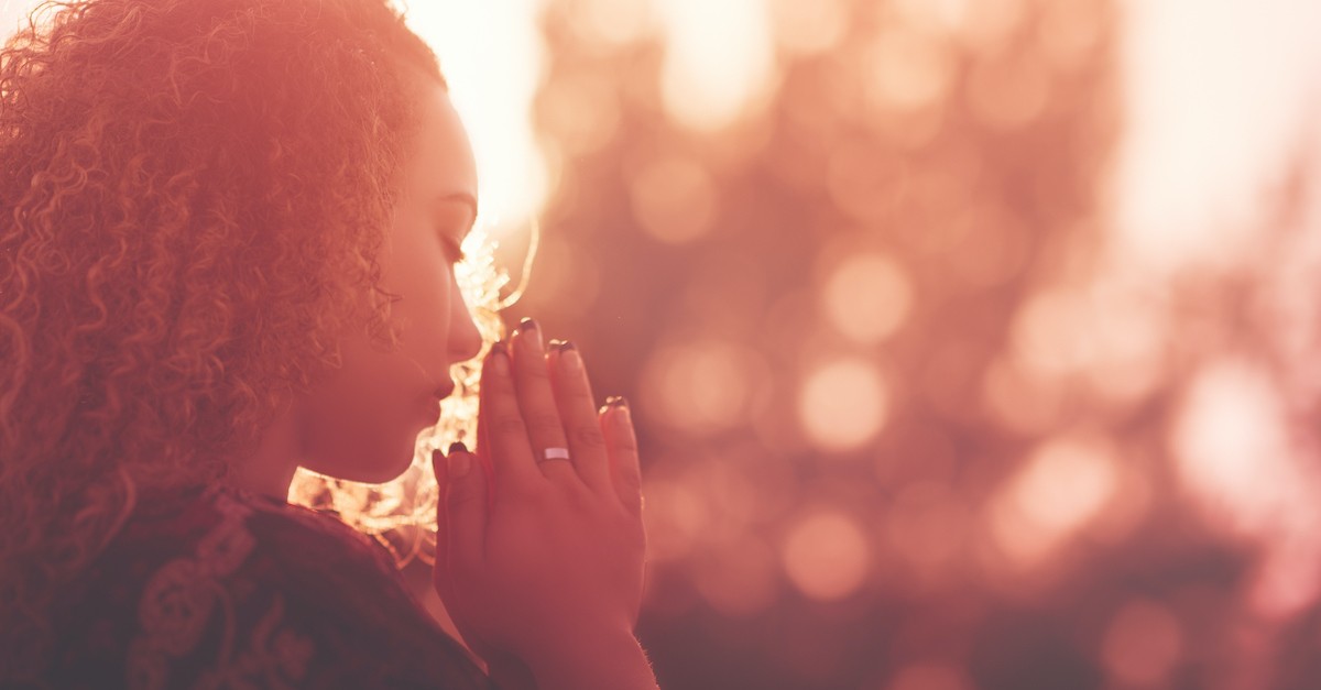 woman praying outside