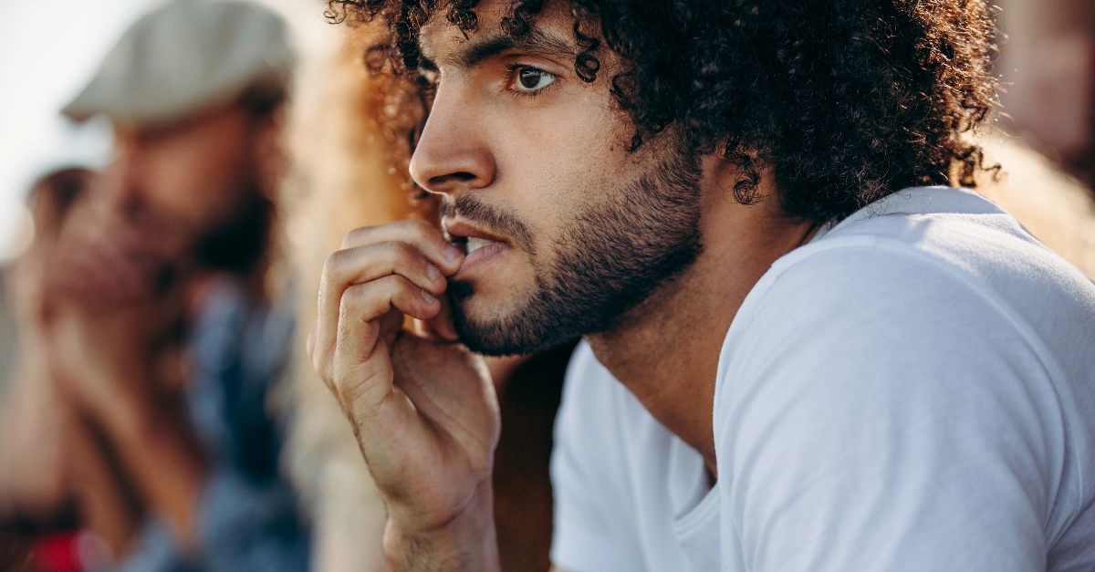Man chewing his fingernails