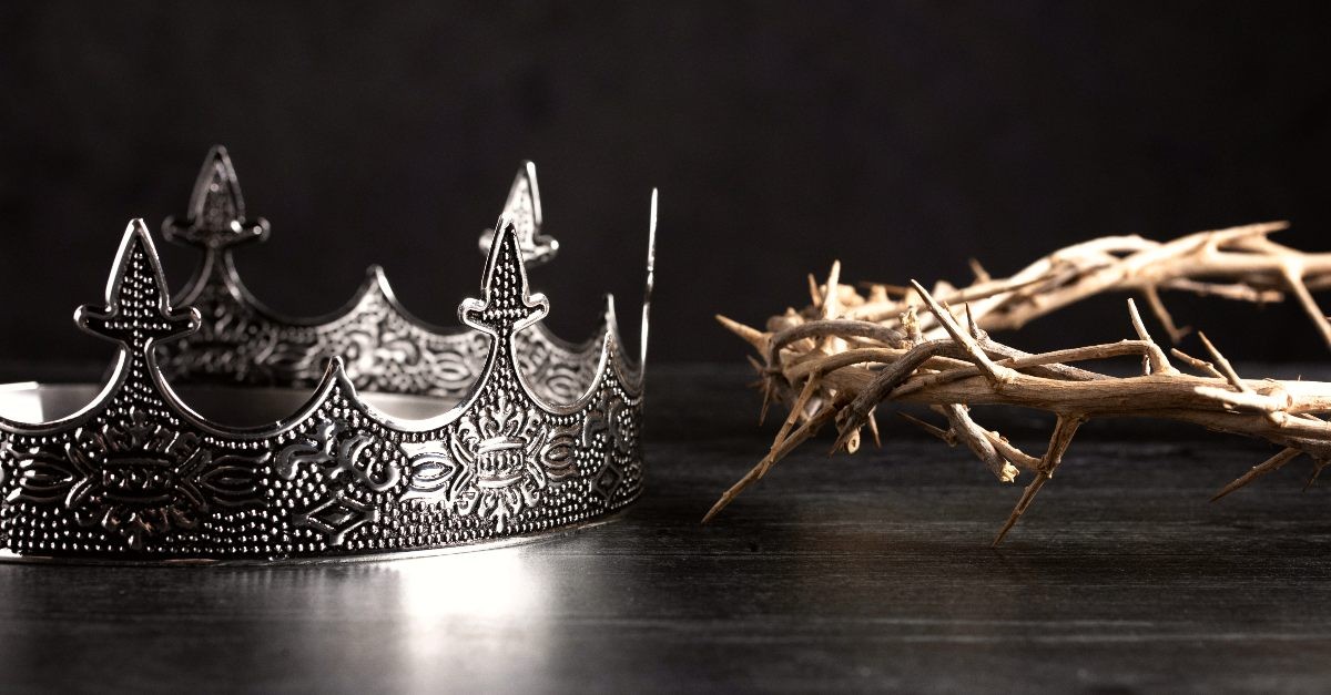 Two crowns one of silver and thorns