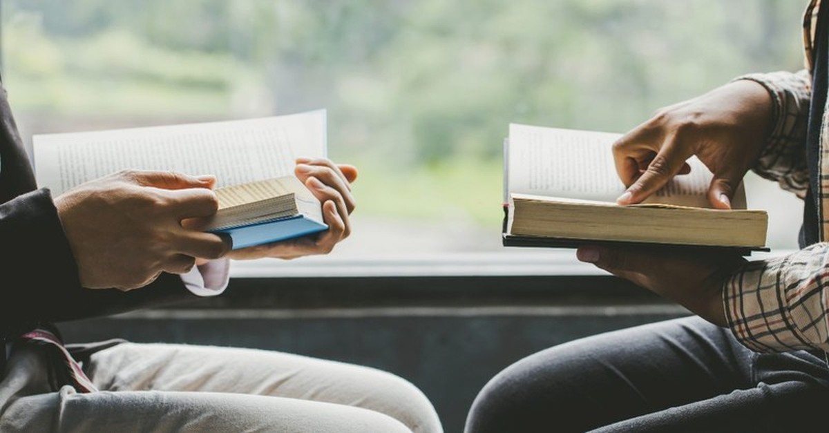 Two people reading the Bible