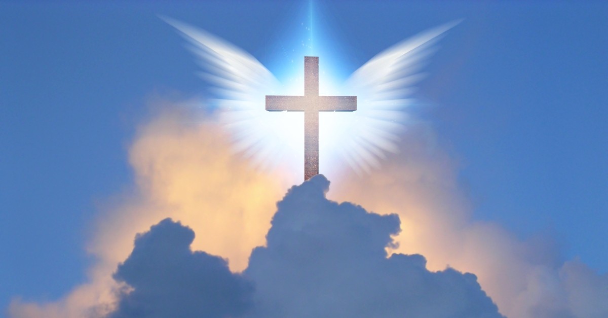 Cross with angel wings in the sky