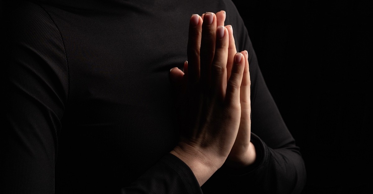 Hands praying