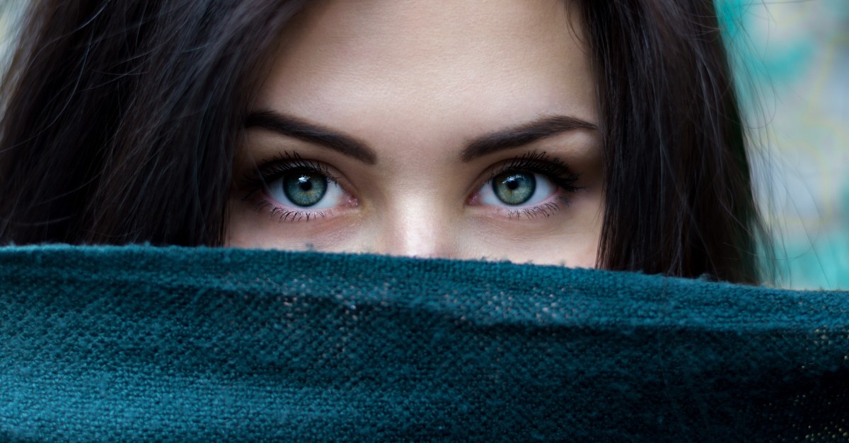 beautiful woman's eyes looking over scarf, things I have to tell myself every day