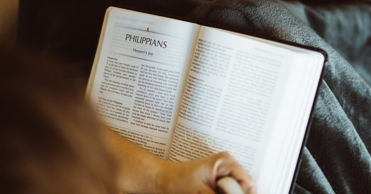 person turning bible pages, walk in the spirit