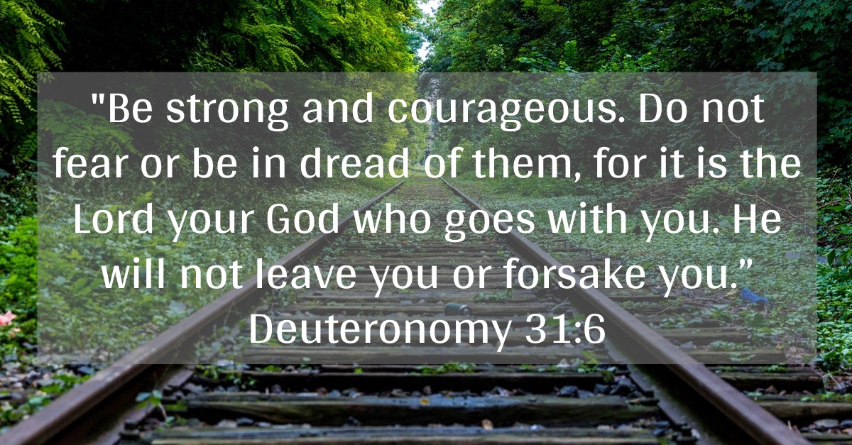 Deuteronomy 31:6 text written out across railroad tracks background
