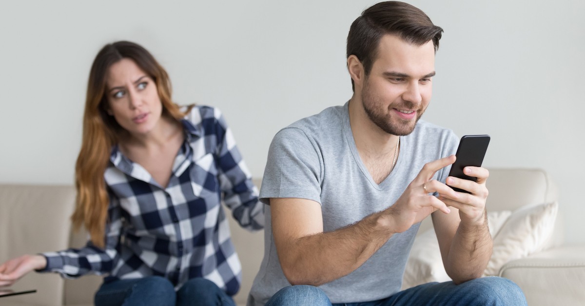 man distracted looking at phone while woman looks upset, bible say about neglecting wife