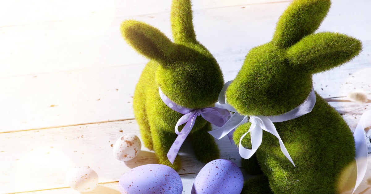 two decorative bunnies with purple eggs