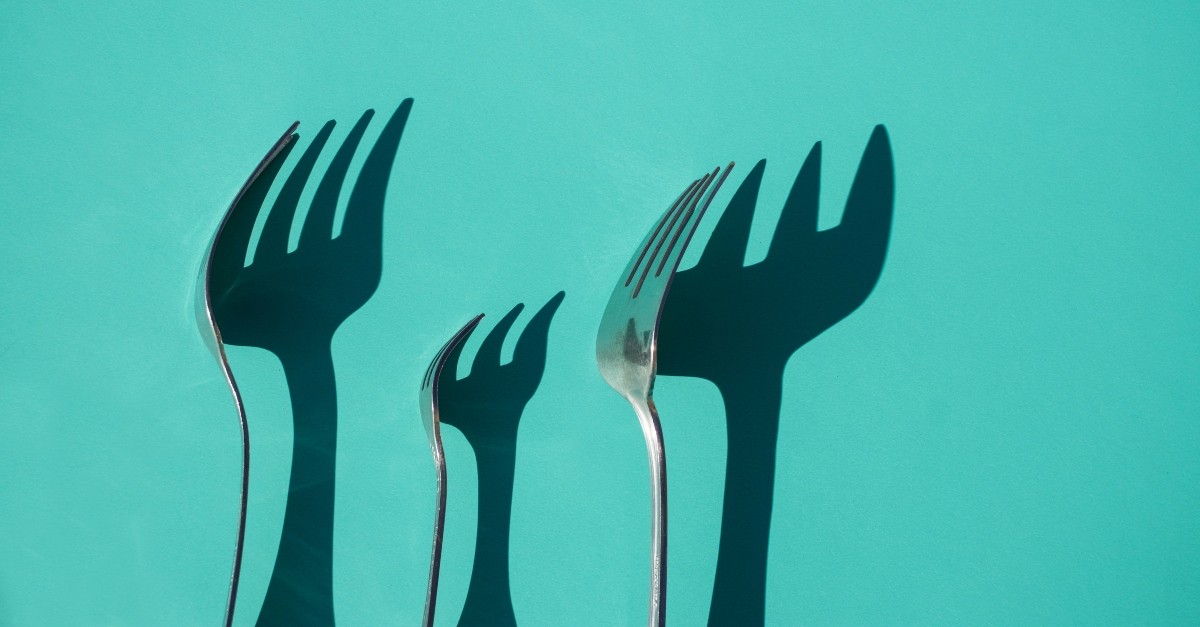forks appearing large in the shadows they cast