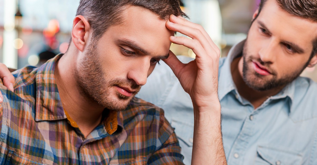 man looking upset friend comforting, what to do when make mistake