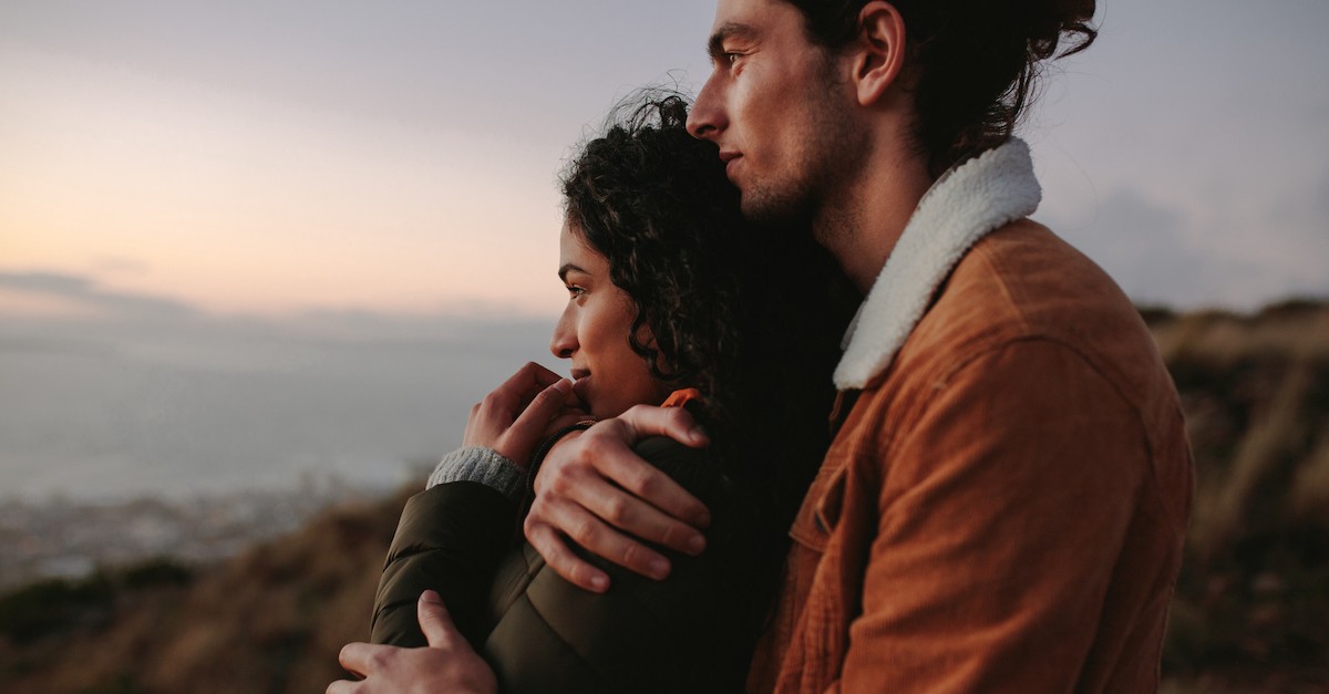 Happy couple hugging on date