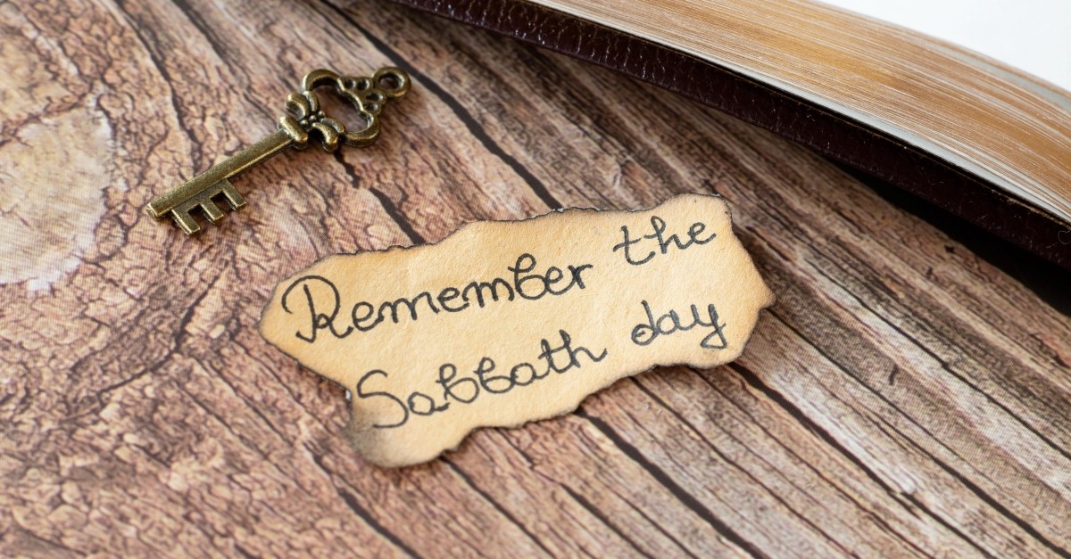 Paper saying "remember the sabbath day" on table, hebrew words in the bible