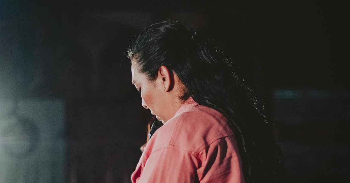 woman speaking at podium