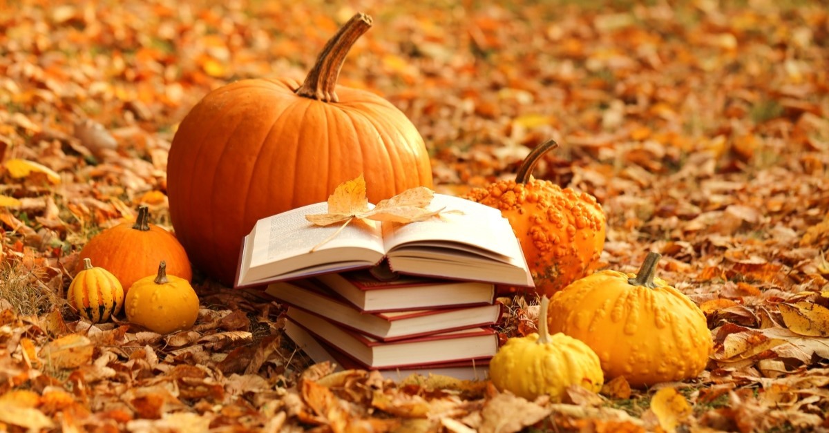 stack of books surrounded by pumpkins and leaves, horror novels by christians