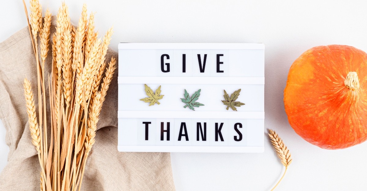 Give thanks sign with gourd and wheat