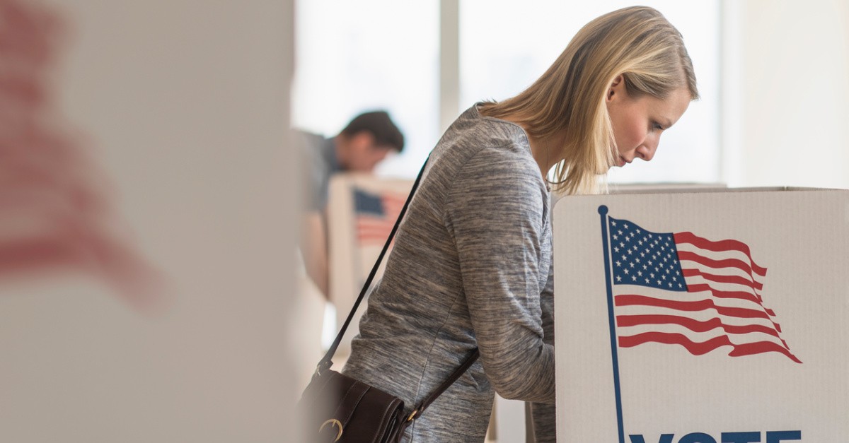 a woman voting, Election Day wrap up