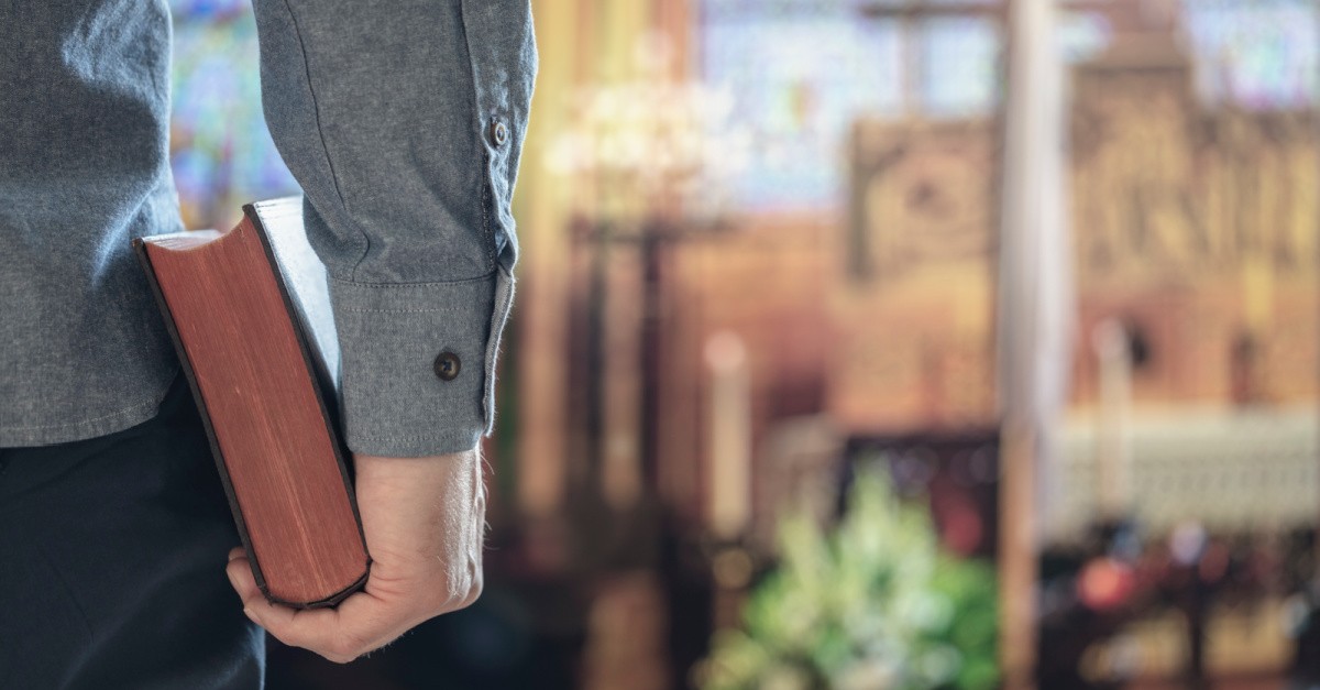 Man holding a Bible,