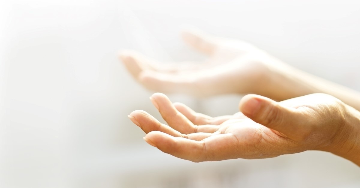 womans hands reaching out toward light, hebrew words in the bible