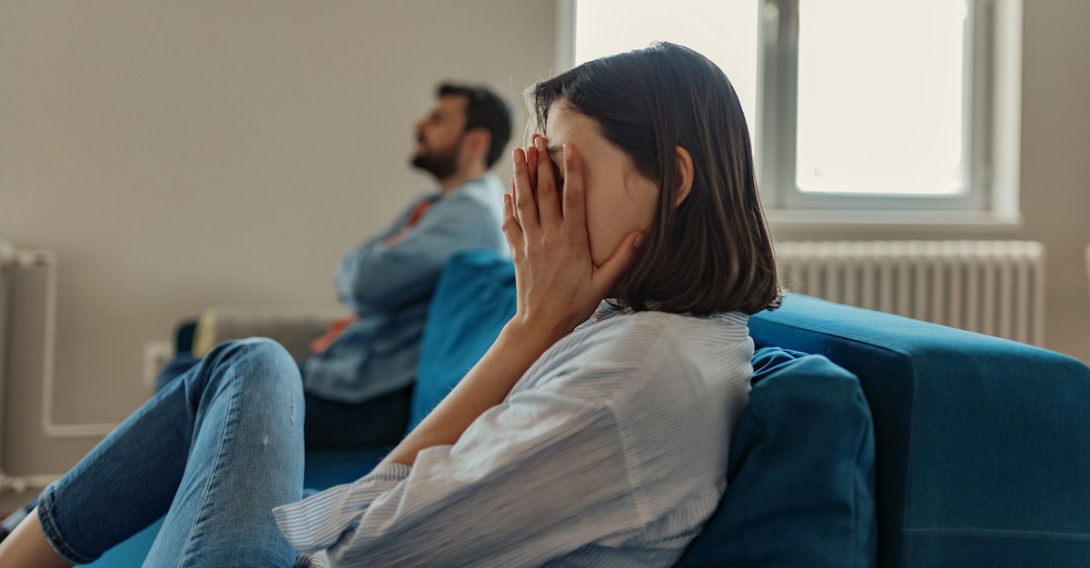 Couple on couch family conflict discussion arguing