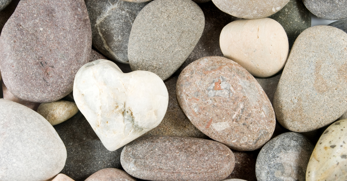 A heart shaped rock among other rocks.