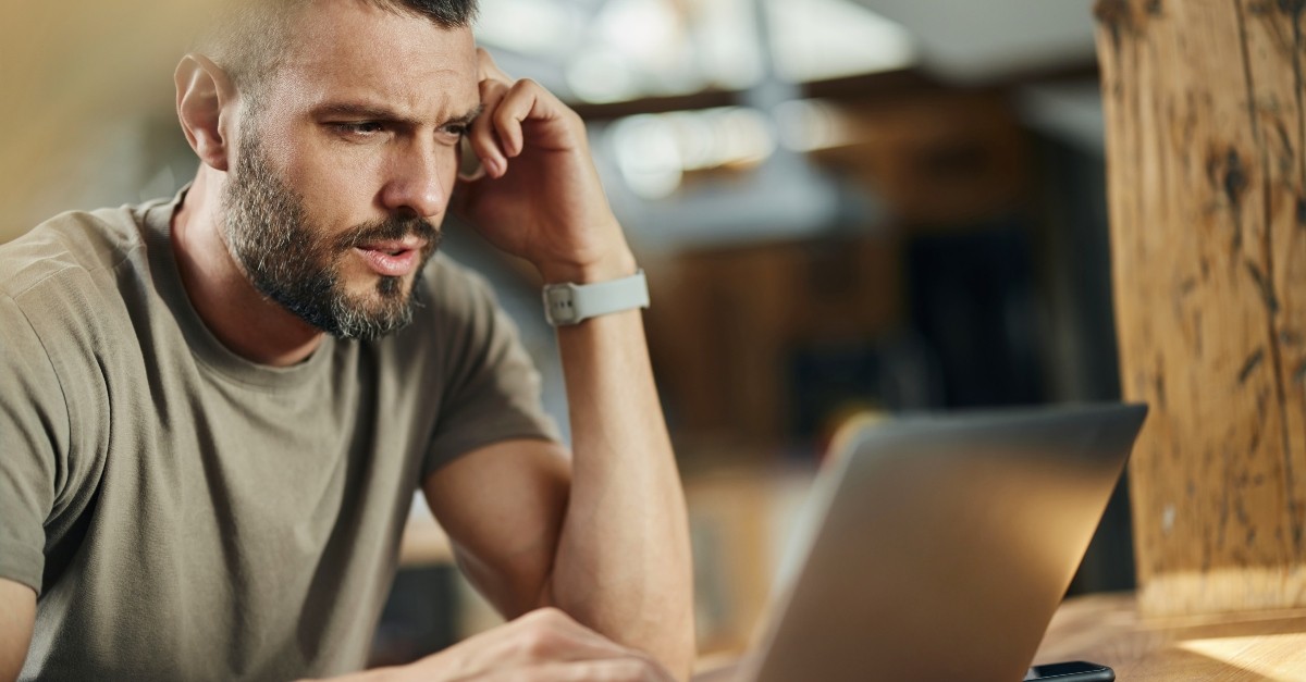 Man looking at his computer