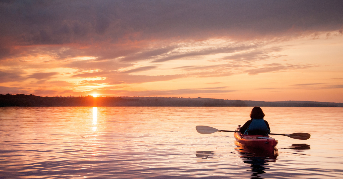 Person kayaking at sunset; remembering who's on our side.