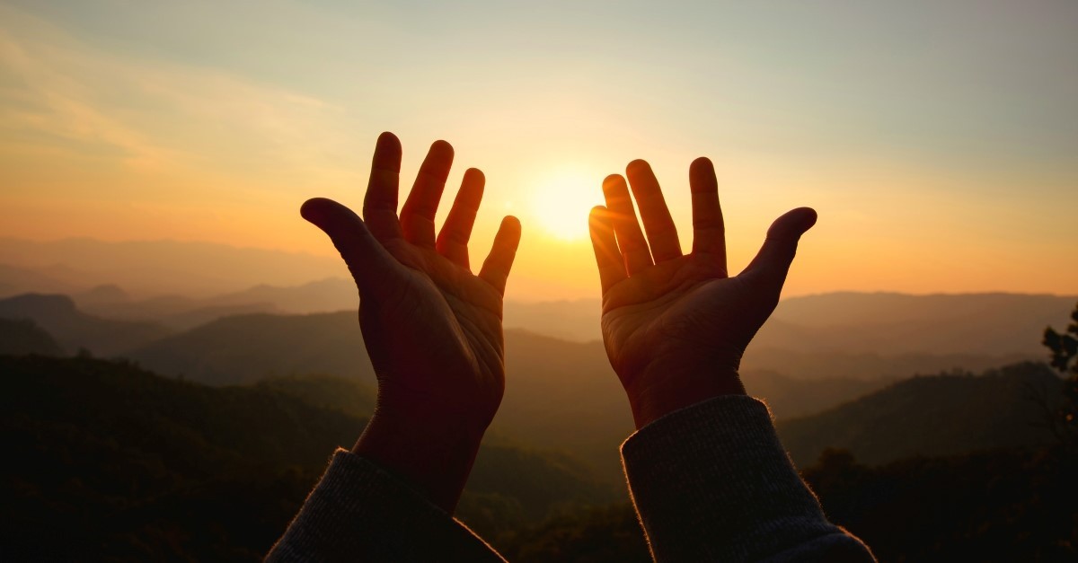 hands raised in prayer to illustrate prayer never fails