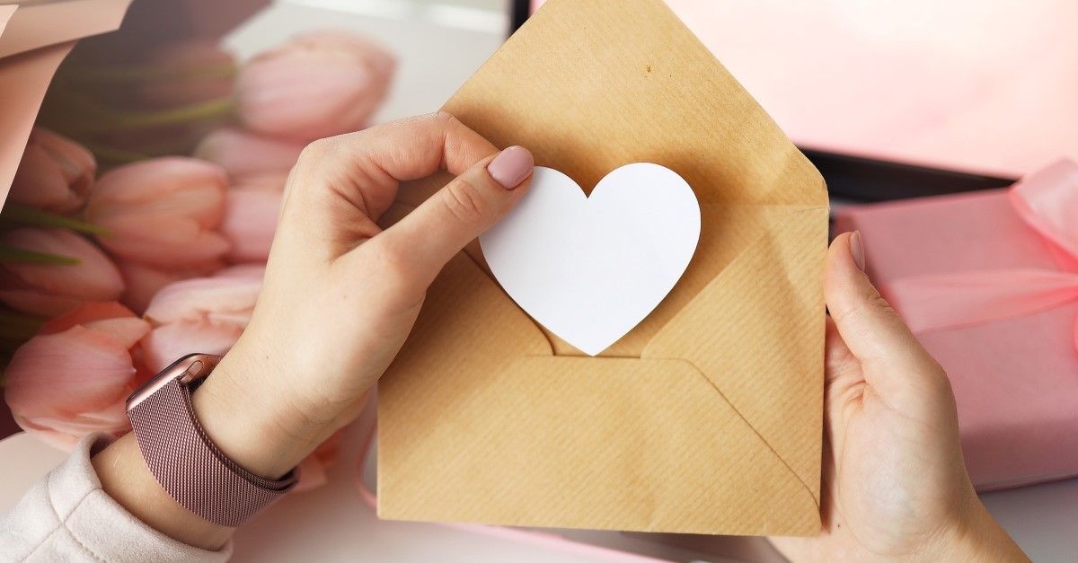 woman making romantic letter to illustrate love letter for husband