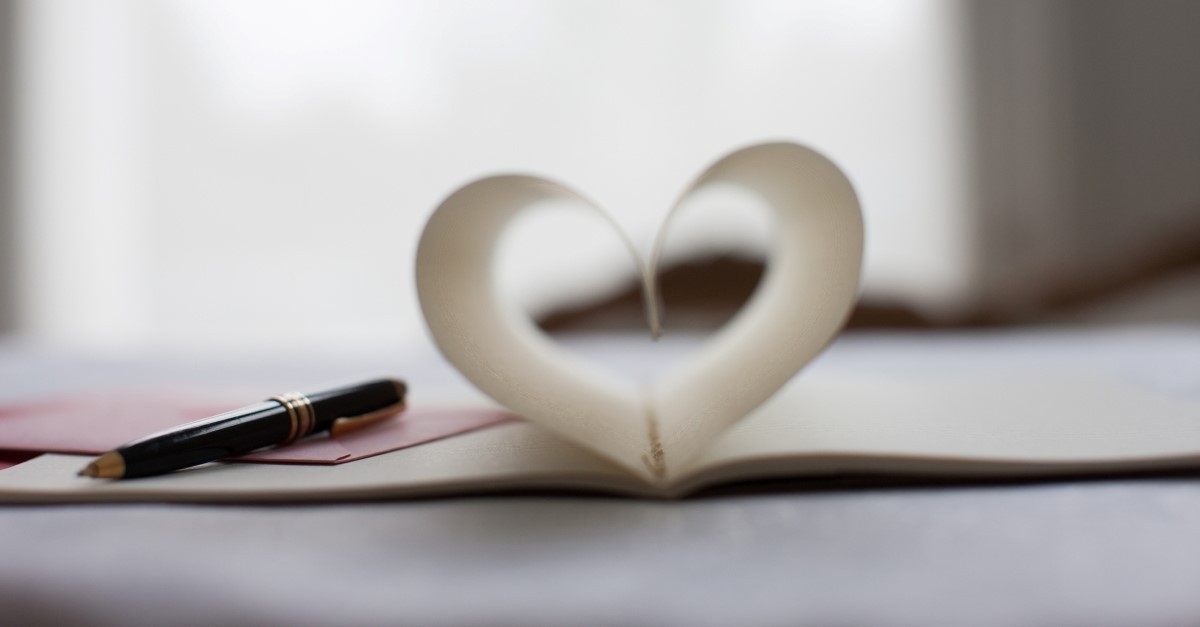 letter folded in heart shape to illustrate love letter for husband