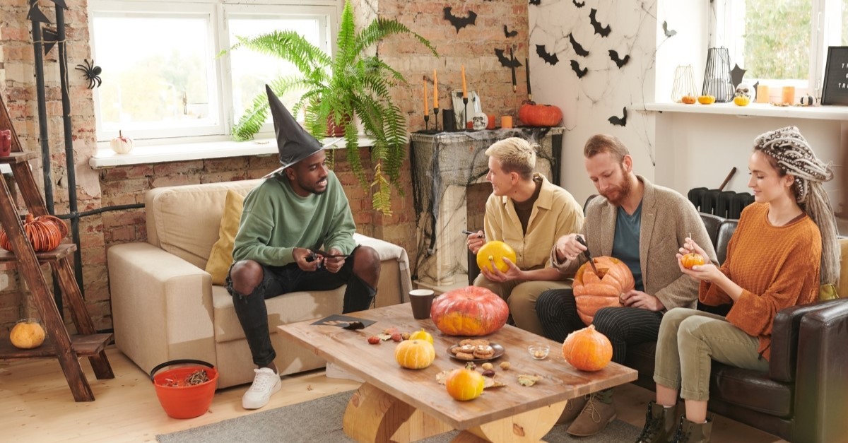 friends making halloween decorations