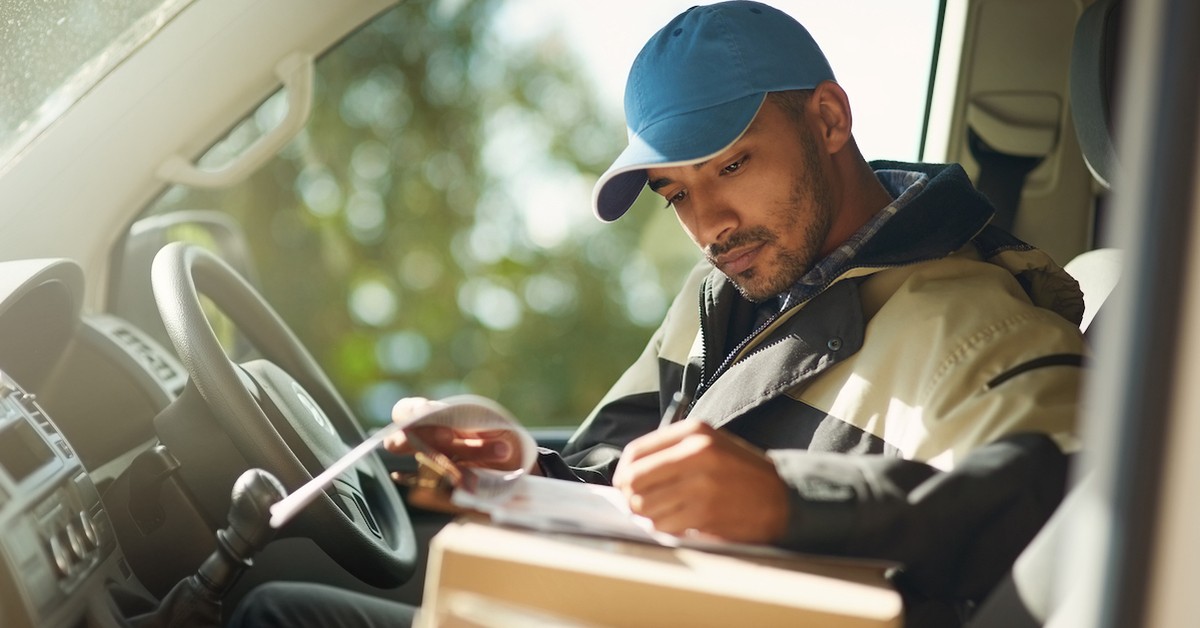 Delivery man working in truck delivering packages