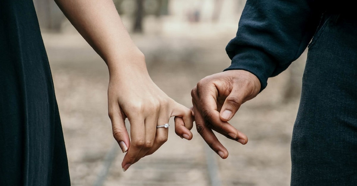 married couple holding hands