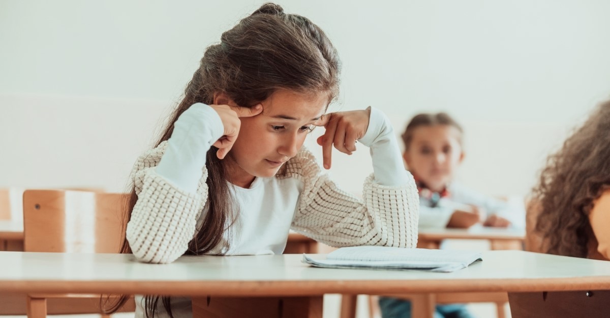 stressed confused little girl taking test, prayer for a test