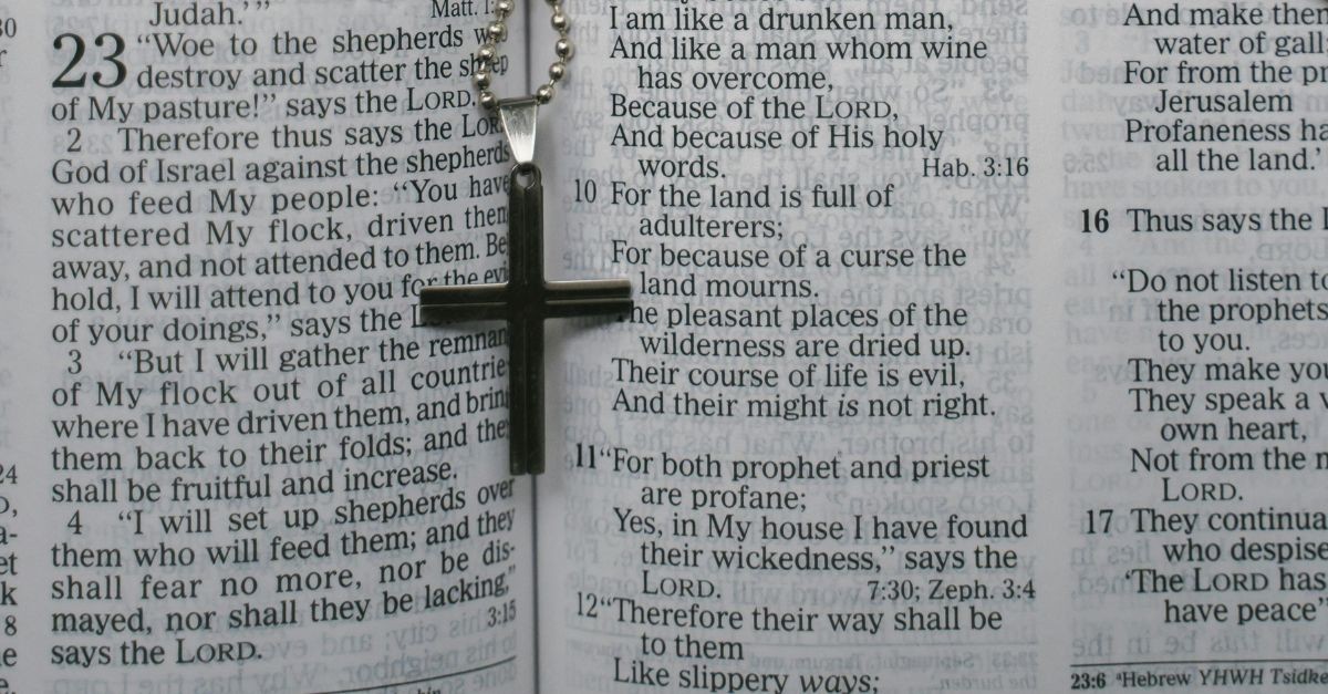 Cross Necklace on an Open Bible