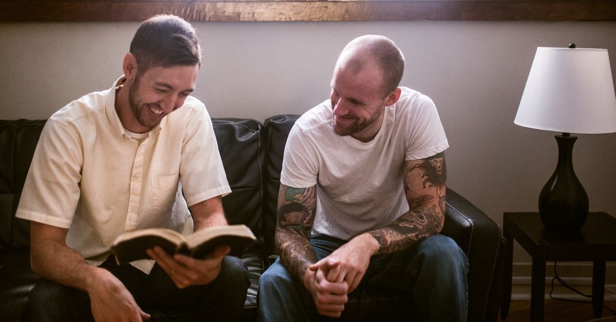 Men studying the Bible together; why do men hate small groups?