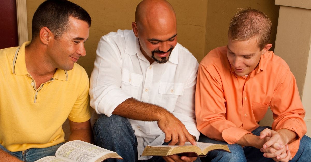 Men studying the Bible; why do men hate small groups?