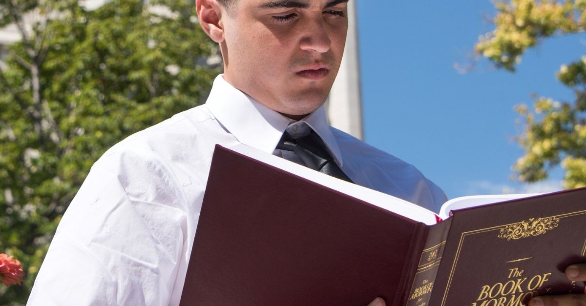 Man reading the Book of Mormon; what do Mormon's beleive?